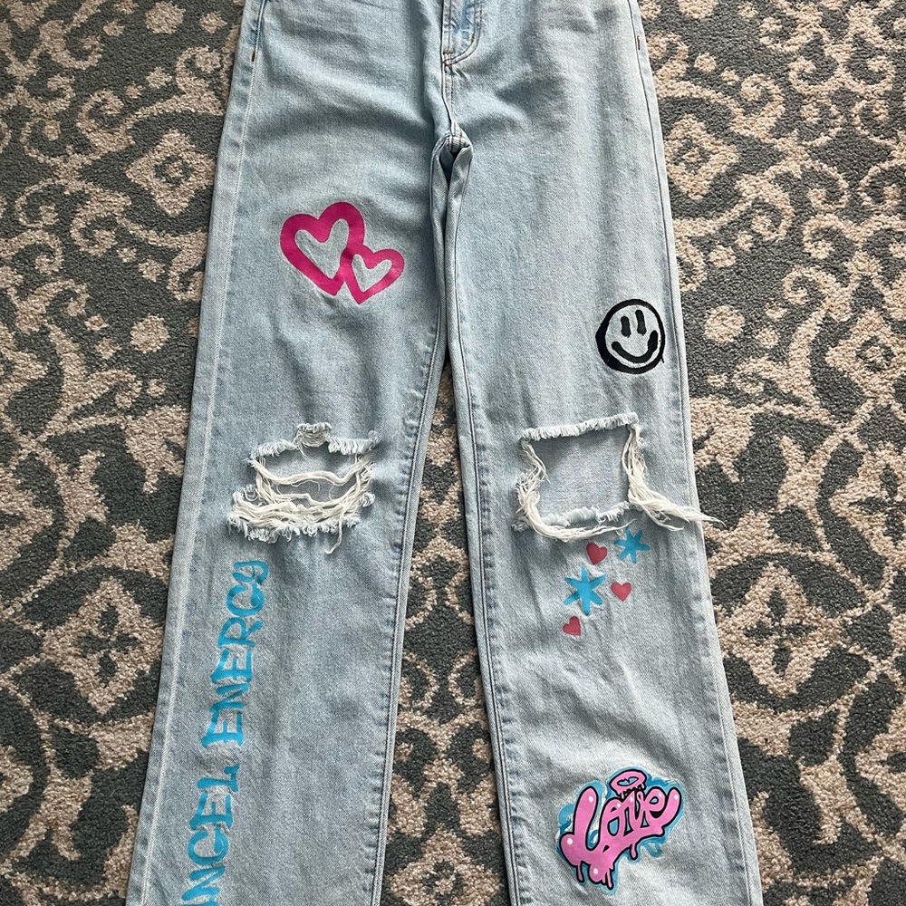 Women's Light Blue Jeans with Graphic Patches